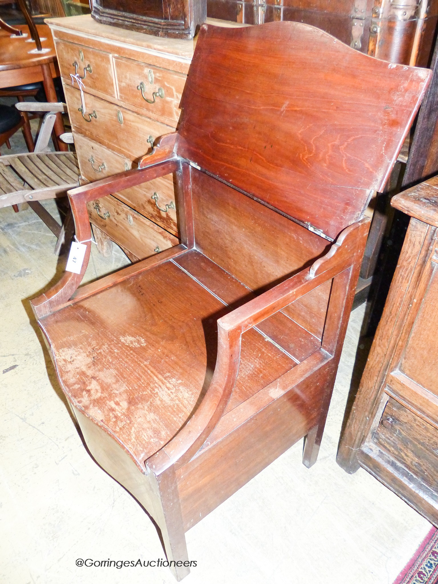 A George III mahogany serpentine front commode, width 58cm, depth 49cm, height 52cm